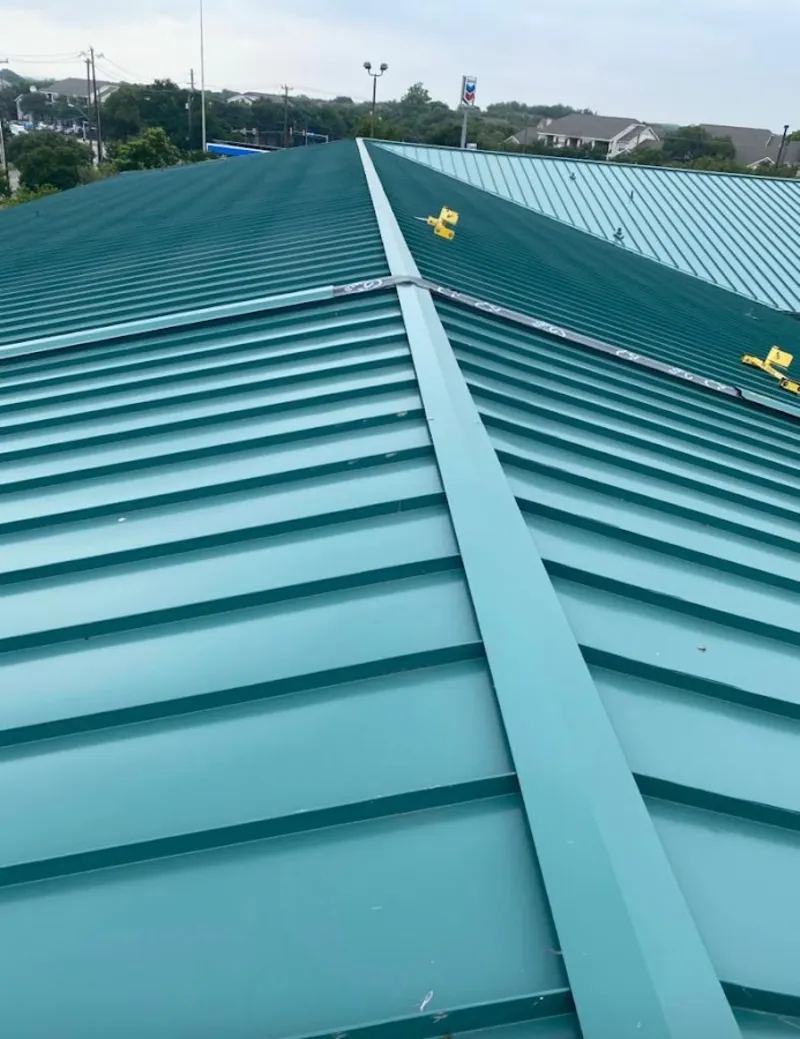 Green commercial metal roof ridge and valley for Metal Roof Repair in Mayfield Heights